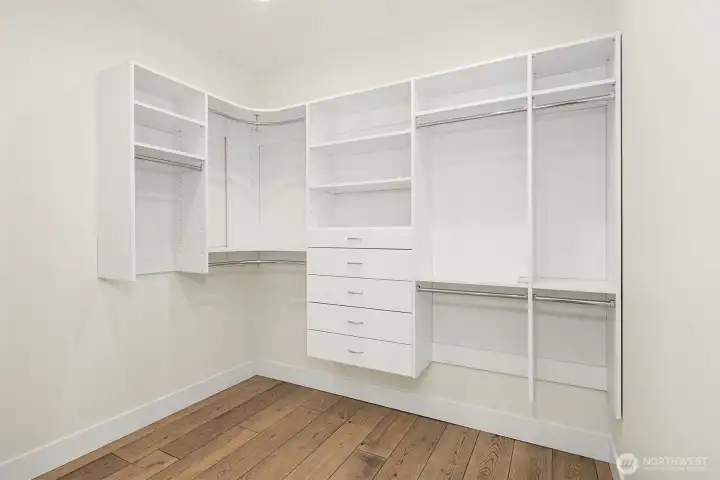 Primary Walk-in Closet with organizers. Primary Walk-in Closet with organizers.