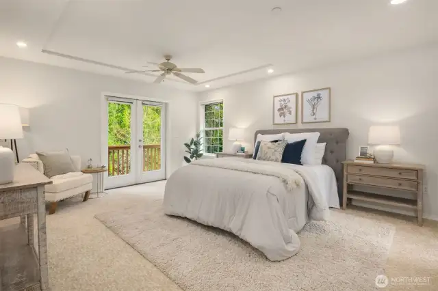 Spacious primary bedroom which opens to a private deck.