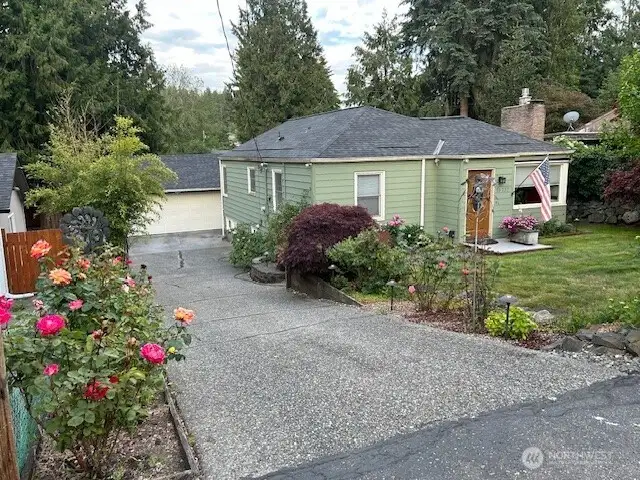 Photo provided by seller to show the colorful roses along driveway.
