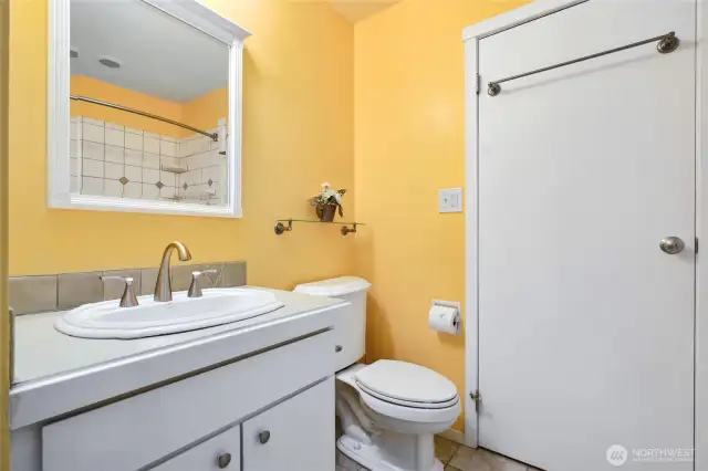 Full bathroom with a tub.