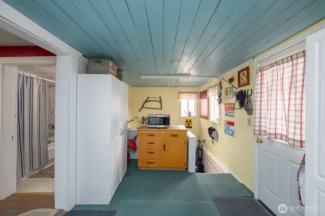 Laundry/Mud Room.  Stairs lead to the crawl space.  There's a freezer, water softener, & ice maker in that space.