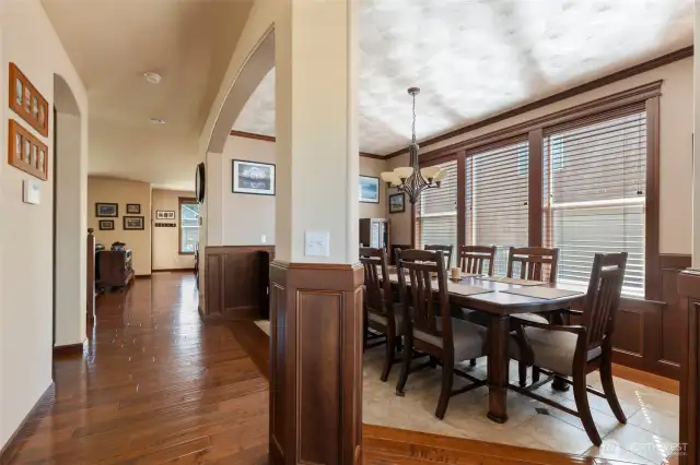 Formal dining room with textured ceiling and crown moulding