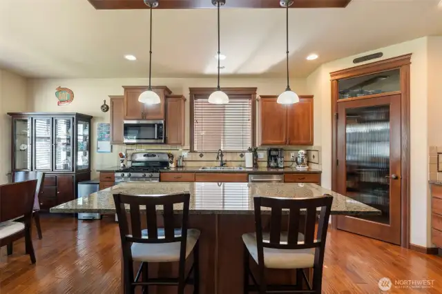 Island provides storage as well as extra seating space