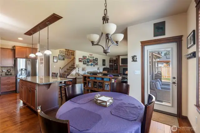 Nook leads to covered back patio while being open to main room