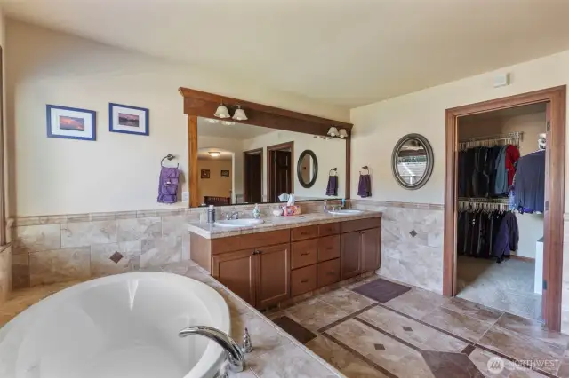 Upgraded tile throughout primary bathroom
