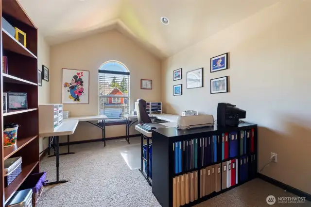 Fourth bedroom (with vaulted ceiling!) currently being used as a craft room