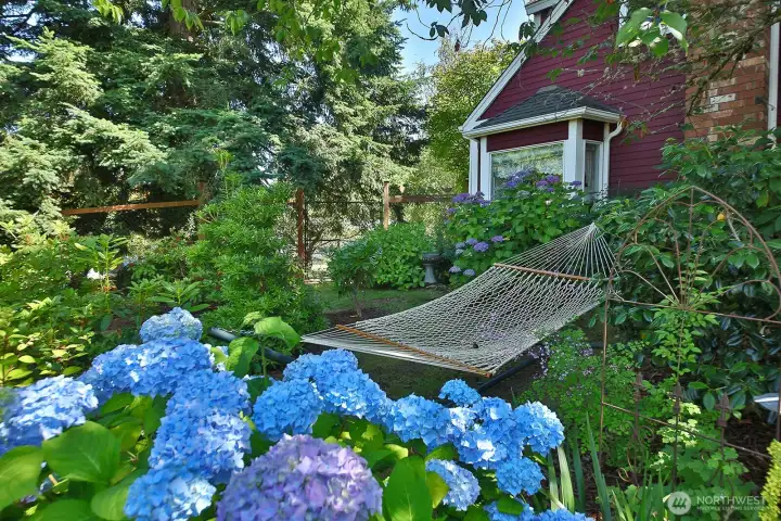 Your own private sanctuary, a short stroll to Langley's seaside village. Sale includes the adjacent vacant lot for continued garden enjoyment or future development.