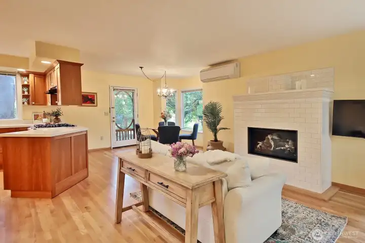 Updates during ownership include ductless mini-splits throughout, removal of the previous free-standing stove and the addition of the new propane fireplace and mantel. A small half wall was also removed, opening the living/dining space.