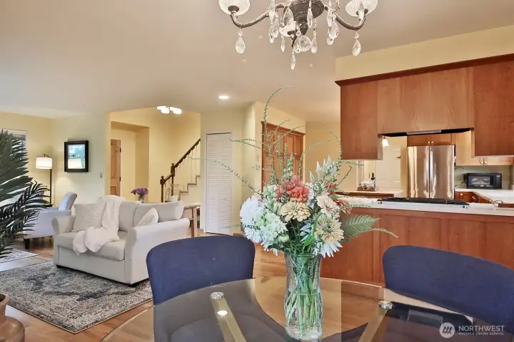 Looking back from the dining area. There is closet/pantry space in the closet (louvered white doors) under the stairs along with a whole wall of pantry space on the wall to the right of the louvered door closet.