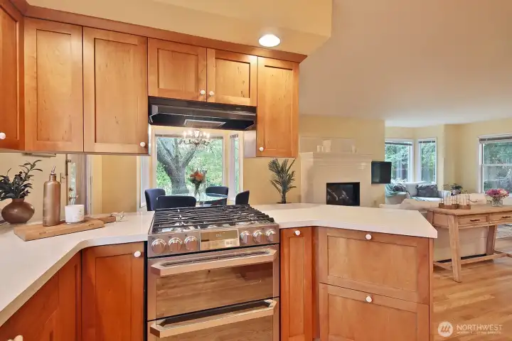 Newer stainless appliances, including a propane cooktop and double oven.