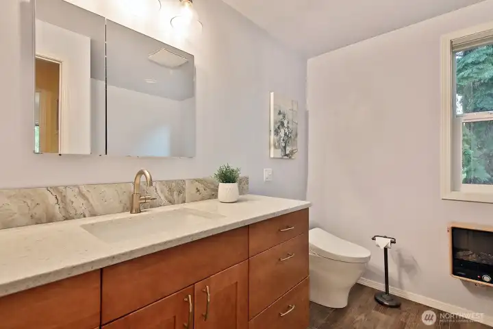 This updated bathroom is along the west side of your home and is located near Bedrooms #3 and #4.