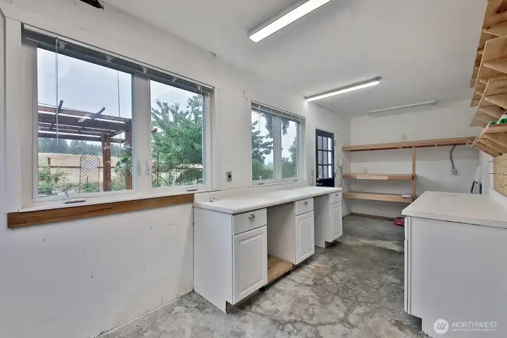 Extra space for gardening or shop space. More windows making this a light-filled working space and includes your view of Fossek Farm. Door goes to your backyard.