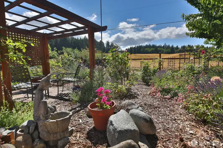 Tall deer fencing surrounds most of the property and there are several gates along the fencing.