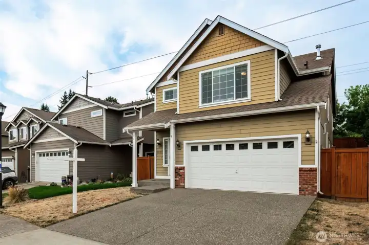 Another angle of the exterior highlighting driveway and curb appeal.