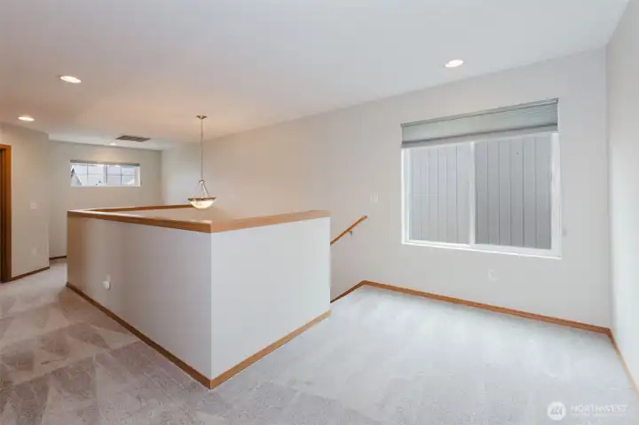 Open loft space perfect for a second living room or office.