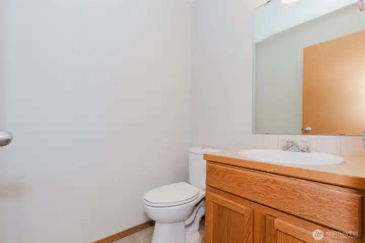 Main level half bath with pedestal sink.