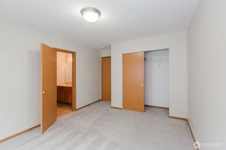 Bedroom with double closet doors.
