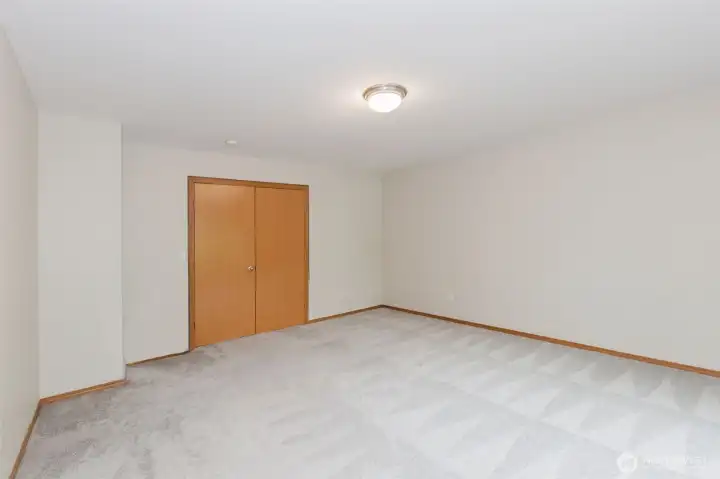 Bedroom with closet and natural light.