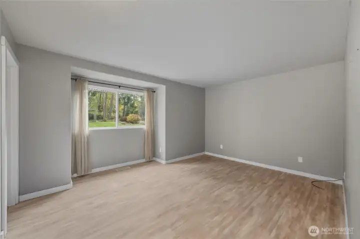 Primary bedroom with views of private backyard