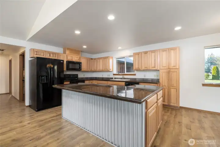 The kitchen has a pantry and lots of counter space w/a large island.