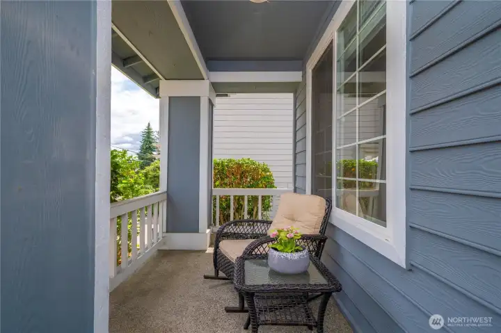 Enjoy peaceful moments on the charming covered front porch, perfect for relaxing anytime.
