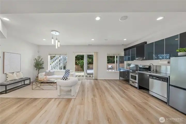 A spacious family room downstairs offers a comfortable gathering space for everyday living and entertaining.