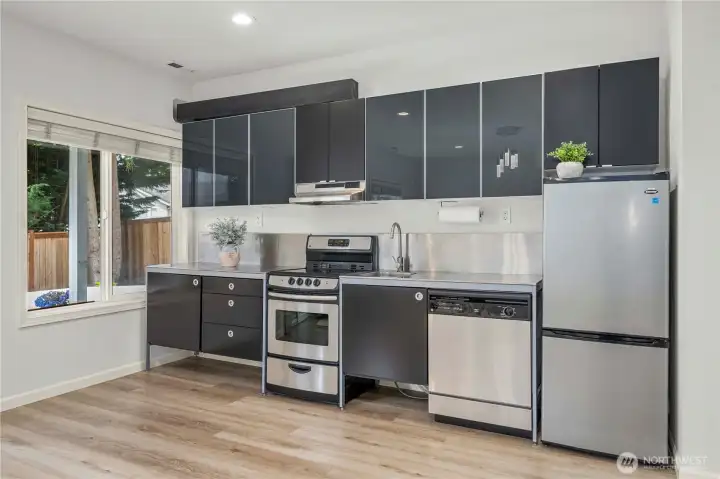 The spacious downstairs MIL suite offers privacy and convenience for guests or extended family.