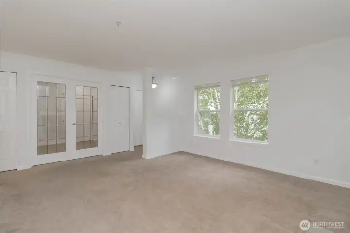 Additional view of the living area and entryway highlighting the open layout and inviting entry.