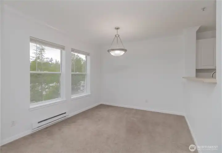 Dining area featuring a convenient service bar from the kitchen.