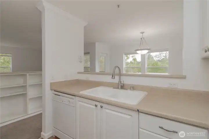 Kitchen with open views into the living and dining areas.