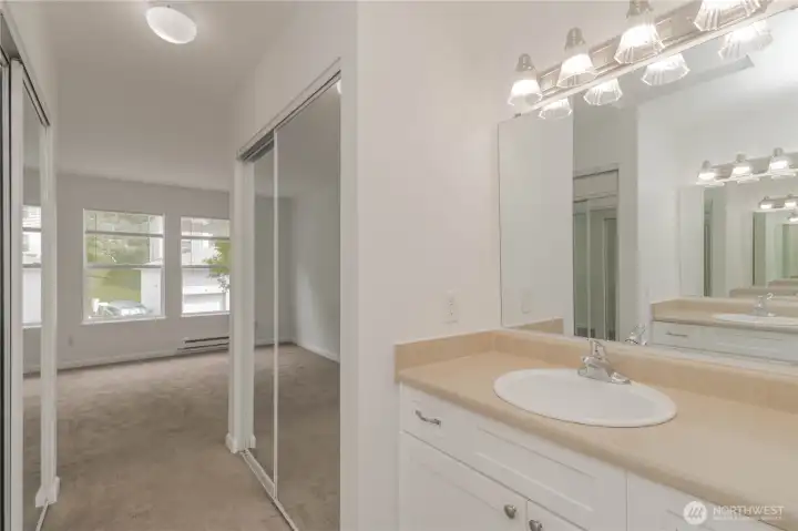 Primary bathroom featuring his-and-hers closets for added convenience.