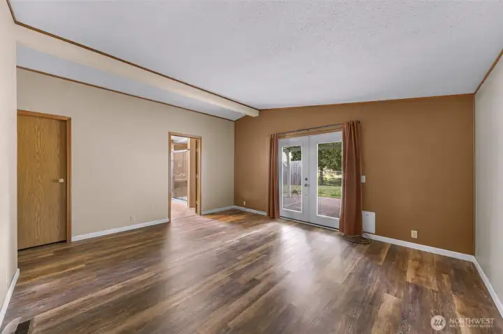 Large primary bedroom with private access to covered back porch.