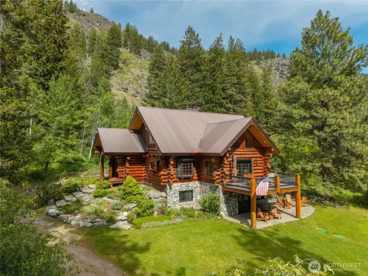 A rare Methow Valley legacy retreat on 19.07 private acres, with additional acreage available, where handcrafted log architecture, towering evergreens, open meadowlands, and dramatic mountain backdrops come together in an extraordinary mountain setting. Enjoy trails, privacy, and four-season recreation right from your doorstep, while still being an easy walk or bike ride to the Mazama Store, Public House, and the heart of the Mazama community. A timeless mountain home designed for gathering, adventure, and generations of memories in one of the valley’s most treasured locations.