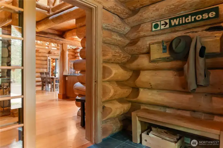 Welcome through the authentic Methow mudroom entry, designed as a classic mountain airlock with slate floors, handcrafted log details, and warm natural wood finishes. A functional and inviting transition space created for all four seasons of Methow Valley living.