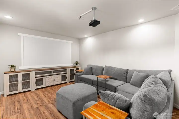 Media room with screen and projector included.