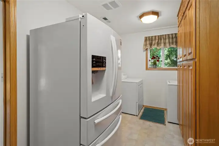 Utility room off of kitchen with tons more storage on the right! Utility room off of kitchen with tons more storage on the right!