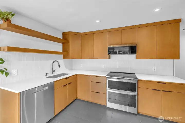 Kitchen with custom built cabinetry. Soft close. Ample storage. New appliances.