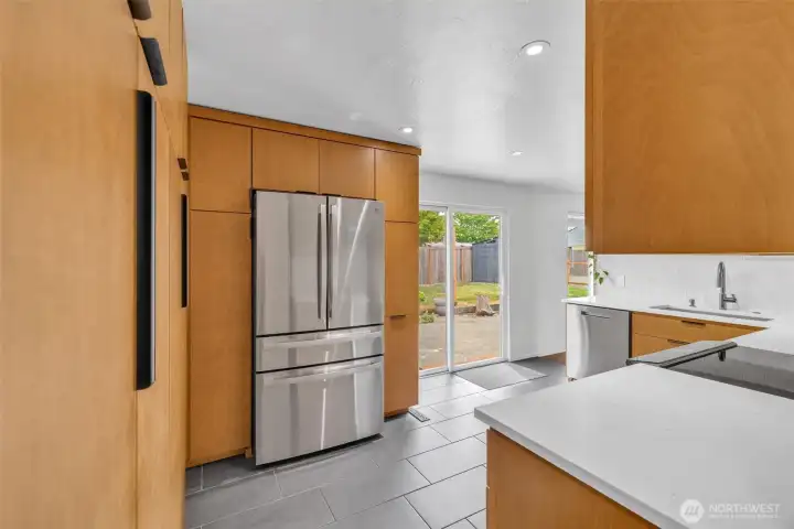sliding door off the kitchen leads to backyard. Perfect for entertaining. Fitted with concrete slab.