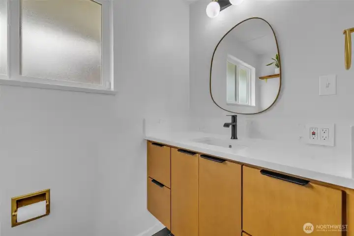 Full bath vanity and mirror.