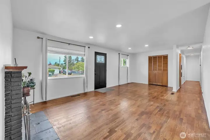 view of entry way/den area. The hallway leads to the bedrooms and full bath.