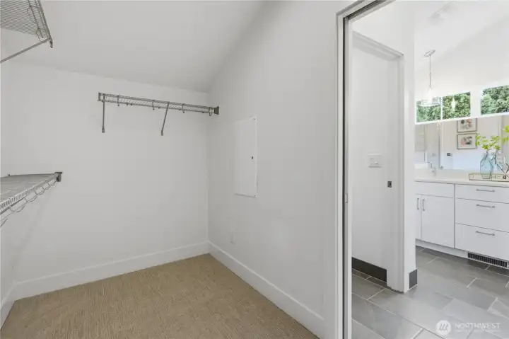 Walk-in closet in primary suite. Walk-in closet in primary suite.