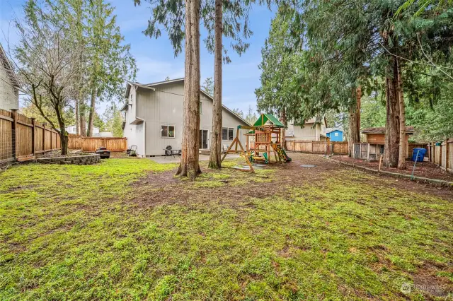 Over 1/4 acre lot that is shaded by cedar trees & offers great area to play.