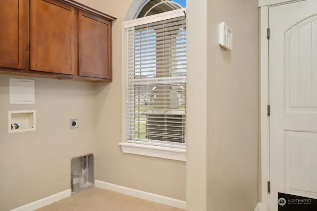 Utility room/Mud Room just off entry to three car garage.