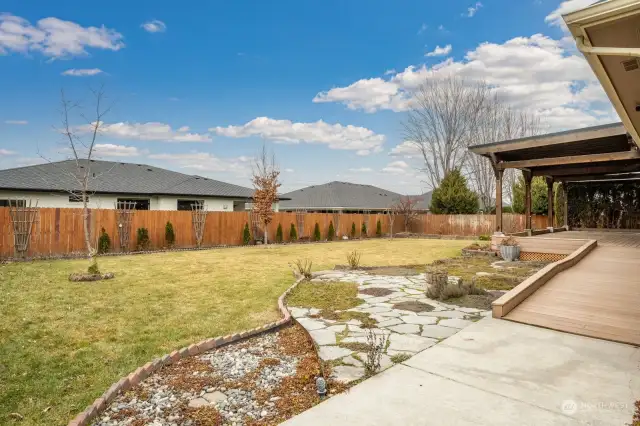 Beautiful fenced and landscaped back yard with westerly sunsets.