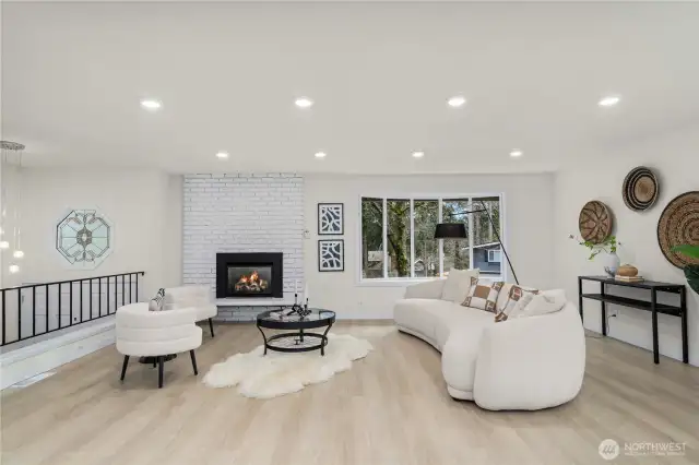 Open floor plan with a gas fireplace in living room