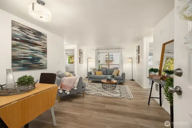 Spacious living and dining room with direct access to private deck
