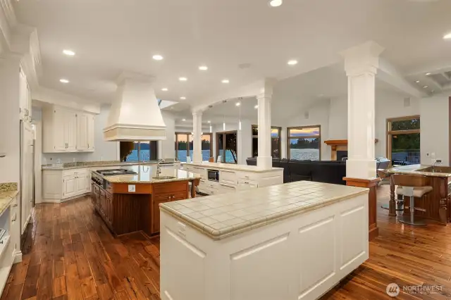 Open Great Room! 3 kitchen islands w/extensive storage. Thermador gas stove, venting system, and double ovens.