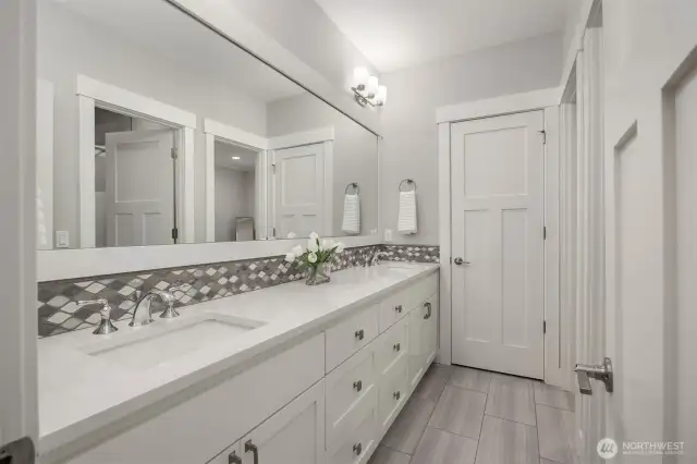 Shared on suite bathroom with Bedroom 3.  With plenty of counter space to spread out and a linen closet.