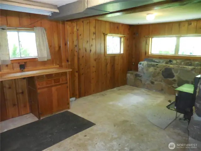 Family Room Downstairs... No Carpet but Seller says Basement has never been wet or seeped any water in this area... Carpet and Go