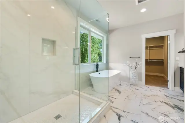 Spacious floor-to-ceiling tiled shower